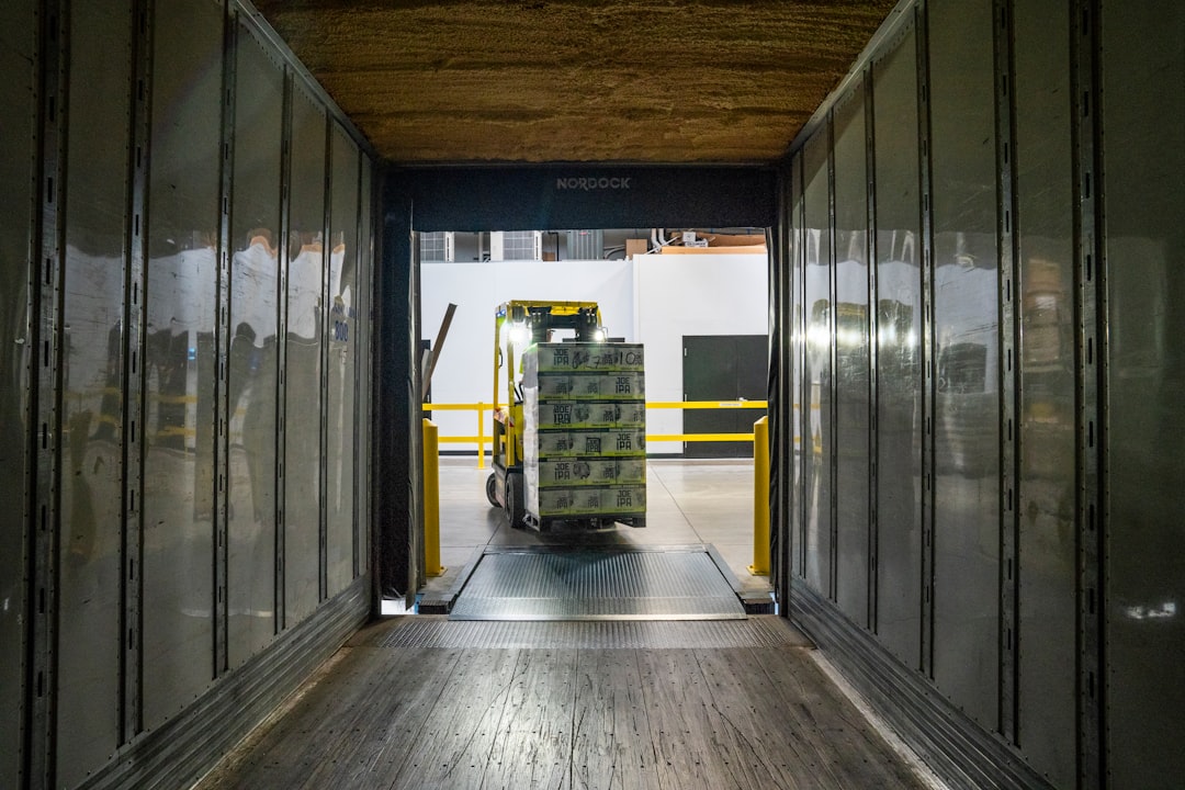 yellow-and-black-forklift-during-daytime-di-axc7dwpq